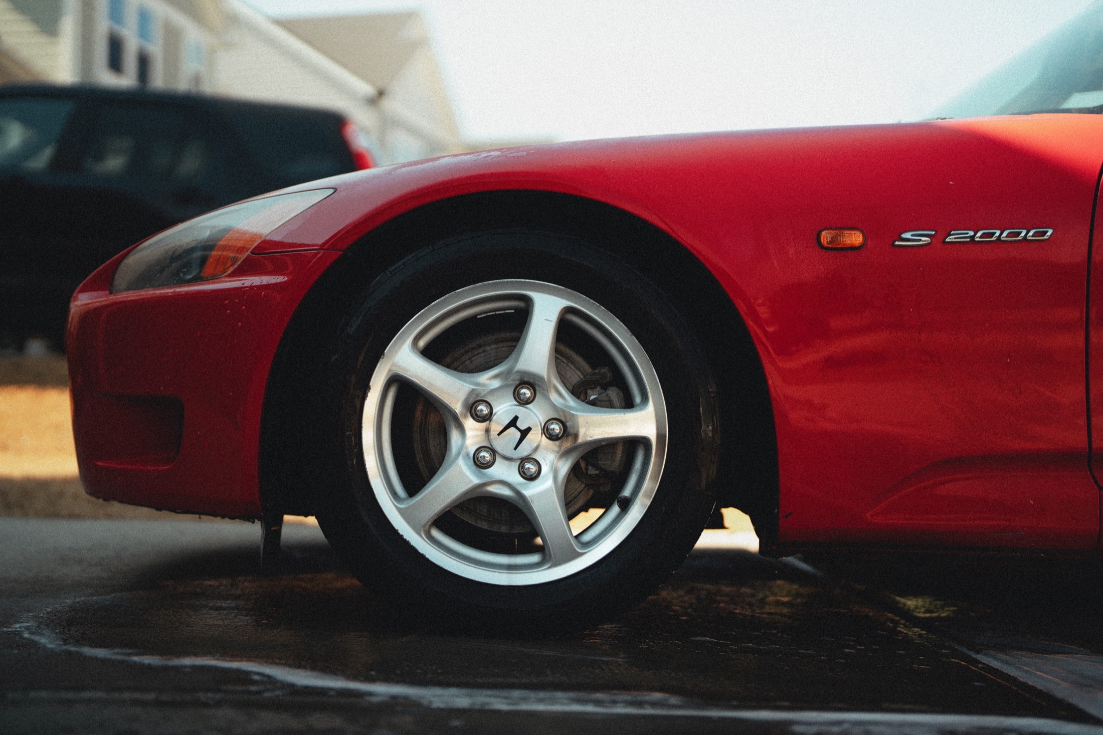 Deep wheel and exterior detail on a performance coupe in Raleigh NC